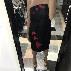 Strapless black satin and hot pink dress